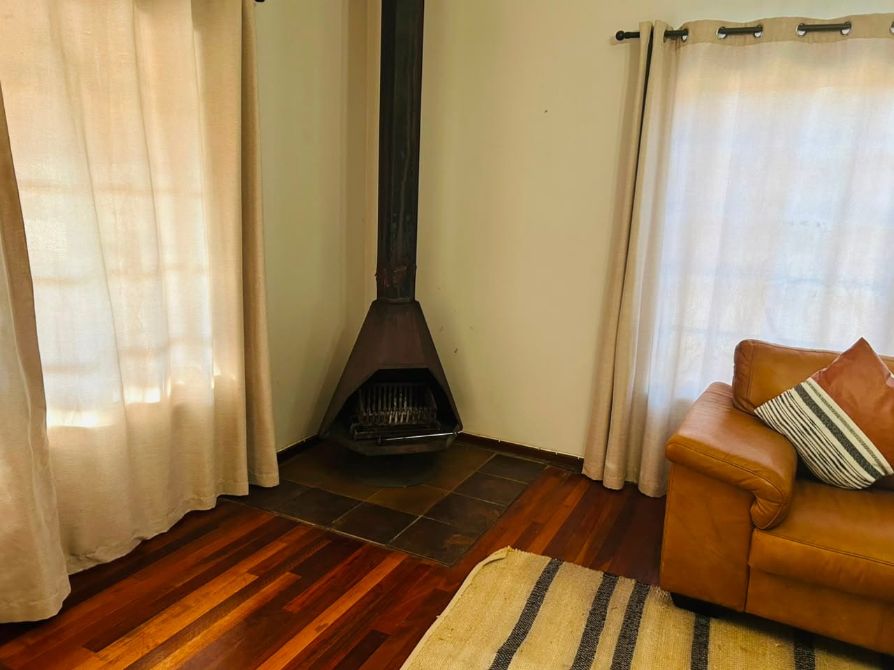 The wood-burning fireplace in the corner of the lounge