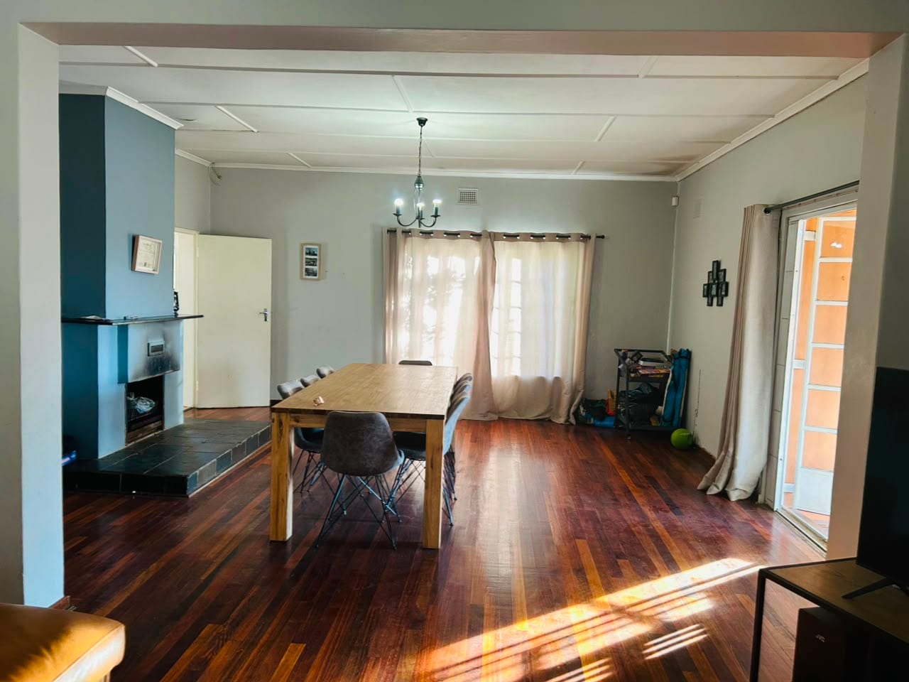 The dining room, with a long table and a second fireplace