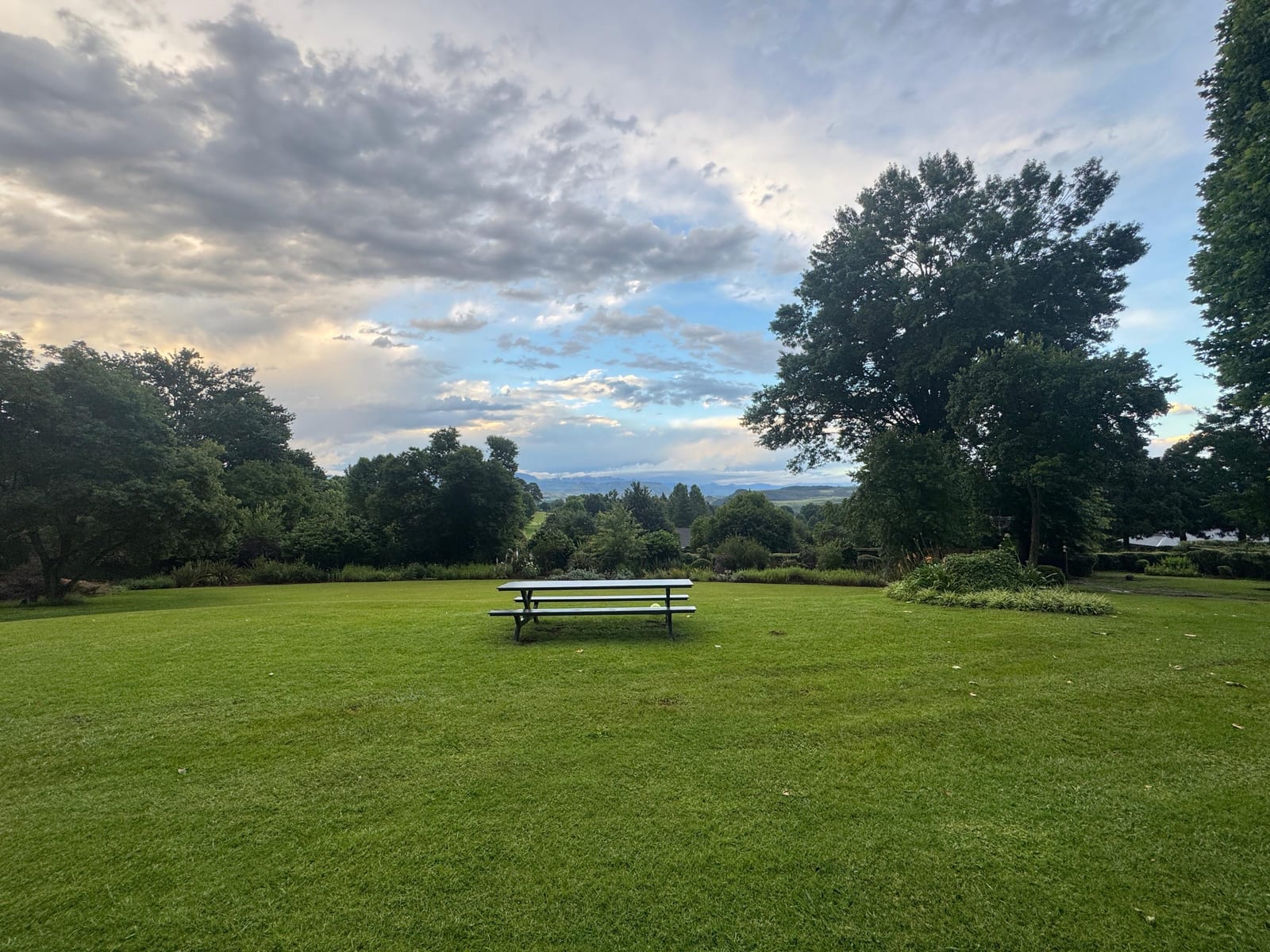 The long table on the lawn, with the valley beyond